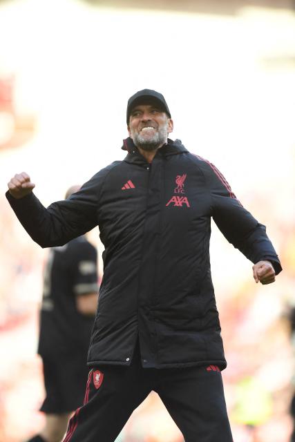 Liverpool Legends' manager Jurgen Klopp celebrates on the pitch after the Legends football match between Liverpool Legends and Dortmund Legends at Anfield in Liverpool, north-west England on March 28, 2026. (Photo by PETER POWELL / AFP)