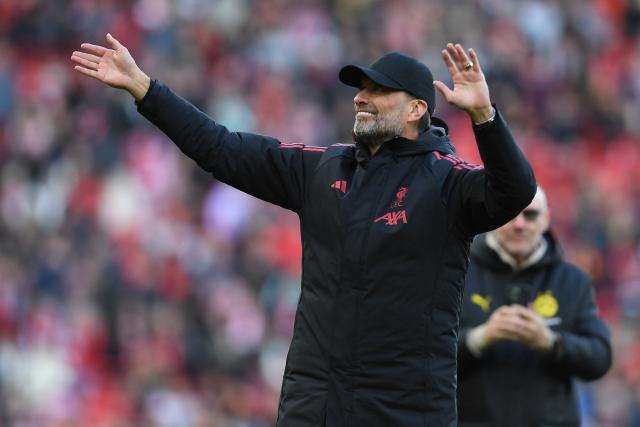 Liverpool Legends' manager Jurgen Klopp gestures to fans on the pitch after the Legends football match between Liverpool Legends and Dortmund Legends at Anfield in Liverpool, north-west England on March 28, 2026. (Photo by PETER POWELL / AFP)
