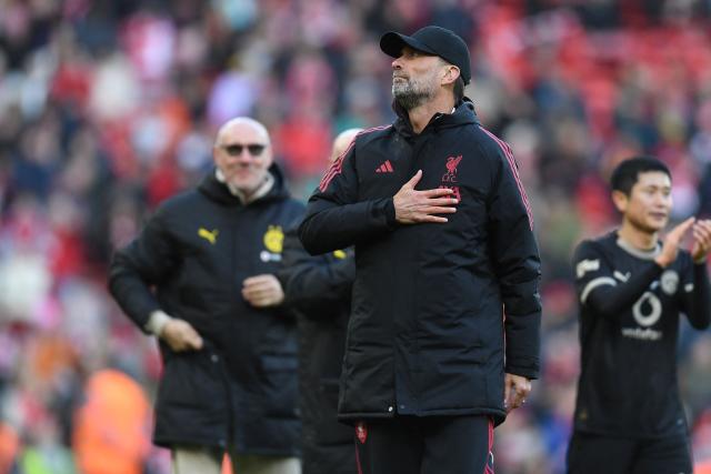 Liverpool Legends' manager Jurgen Klopp gestures to fans on the pitch after the Legends football match between Liverpool Legends and Dortmund Legends at Anfield in Liverpool, north-west England on March 28, 2026. (Photo by PETER POWELL / AFP)