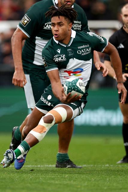 Pau's French winger Theo Attissogbe runs with the ball during the French Top14 rugby union match between Section Paloise Bearn Pyrenees (Pau) and Racing92 at Stade du Hameau in Pau, south-western France on March 28, 2026. (Photo by ROMAIN PERROCHEAU / AFP)