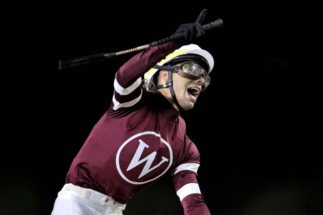 Jockey #2 Jose Ortiz reacts as he wins Race 9 during the Dubai World Cup horse race in Dubai on March 28, 2026. Since the United States and Israel began striking Iran on February 28, Tehran has launched waves of missiles and drones at Gulf states, with more than 2,000 attacks on the UAE alone. (Photo by Fadel SENNA / AFP)