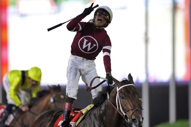 Jockey #2 Jose Ortiz reacts as he wins Race 9 during the Dubai World Cup horse race in Dubai on March 28, 2026. Since the United States and Israel began striking Iran on February 28, Tehran has launched waves of missiles and drones at Gulf states, with more than 2,000 attacks on the UAE alone. (Photo by Fadel SENNA / AFP)