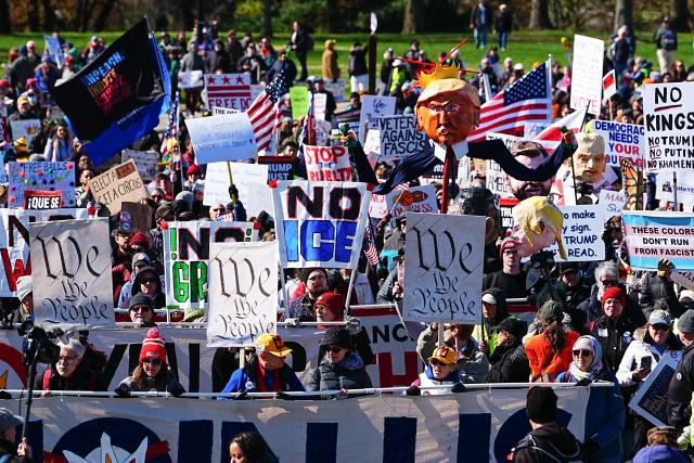 Demonstrators march during the "No Kings" national day of protest in Washington, DC, on March 28, 2026. Nationwide protests against US President Donald Trump are expected Saturday as millions of people vent fury over what they see as his authoritarian bent and other forms of cruel, law-trampling governance. It is the third time in less than a year that Americans will take to the streets as part of a grassroots movement called "No Kings," the most vocal and visual conduit for opposition to Trump since he began his second term in January 2025. (Photo by Aaron Schwartz / AFP)