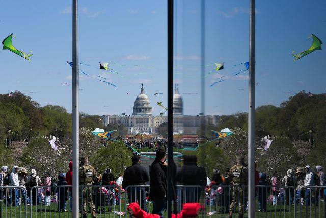 Kites fly along the National Mall during the Cherry Blossom Kite Festival in Washington, DC, on March 28, 2026. (Photo by Ken Cedeno / AFP)