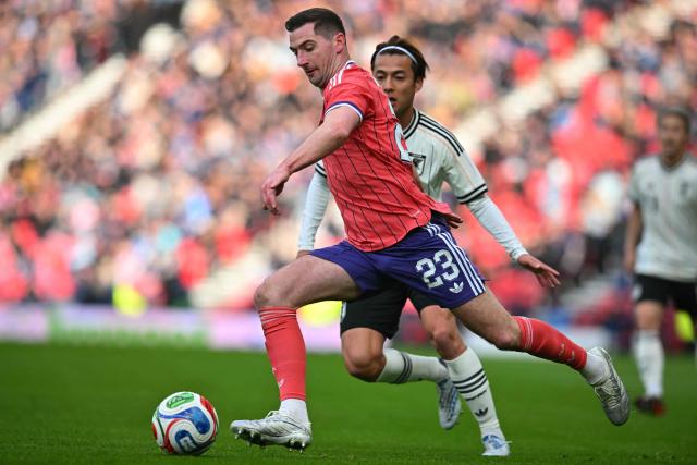 Scotland's midfielder #23 Kenny McLean runs with the ball during the friendly International football match between Scotland and Japan at Hampden Park, in Glasgow, on March 28, 2026. (Photo by ANDY BUCHANAN / AFP)