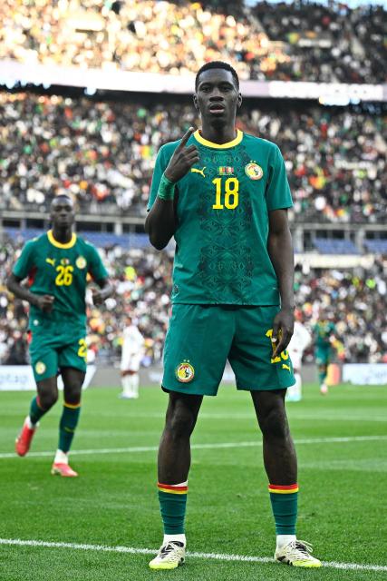Senegal's forward #18 Ismaila Sarr celebrates scoring his team's second goal during the international friendly football match between Senegal and Peru at the Stade de France in Saint-Denis, north of Paris, on March 28, 2026 (Photo by JULIEN DE ROSA / AFP)