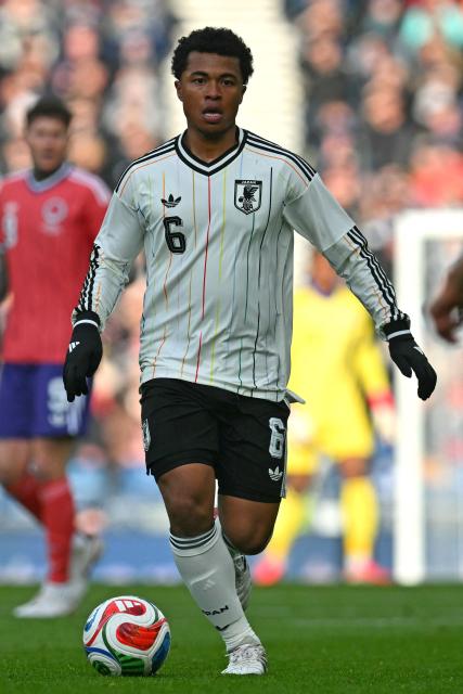 Japan's midfielder Joel Chima Fujita runs with the ball during the friendly International football match between Scotland and Japan at Hampden Park, in Glasgow, on March 28, 2026. (Photo by ANDY BUCHANAN / AFP)