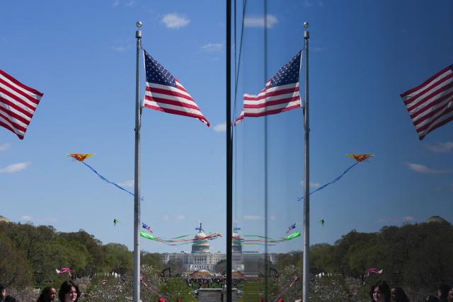 Kites fly along the National Mall during the Cherry Blossom Kite Festival in Washington, DC, on March 28, 2026. (Photo by Ken Cedeno / AFP)