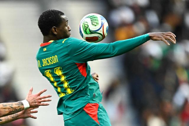 Senegal's forward #11 Nicolas Jackson jumps to control the ball during the international friendly football match between Senegal and Peru at the Stade de France in Saint-Denis, north of Paris, on March 28, 2026. (Photo by JULIEN DE ROSA / AFP)