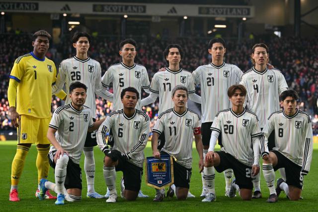 (Back row L-R) Japan's goalkeeper Zion Suzuk, Japan's forward Keisuke Goto, Japan's defender Tsuyoshi Watanabe, Japan's midfielder Ao Tanaka, Japan's defender Hiroki Ito and Japan's defender Ayumu Seko, (front row L-R) Japan's defender Yukinari Sugawara, Japan's midfielder Joel Chima Fujita, Japan's forward Daizen Maeda, Japan's midfielder Kodai Sano and Japan's midfielder Yuito Suzuki pose for a team photo ahead of the friendly International football match between Scotland and Japan at Hampden Park, in Glasgow, on March 28, 2026. (Photo by ANDY BUCHANAN / AFP)