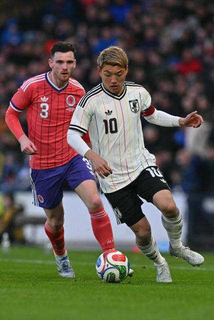 Japan's midfielder Ritsu Doan controls the ball during the friendly International football match between Scotland and Japan at Hampden Park, in Glasgow, on March 28, 2026. (Photo by ANDY BUCHANAN / AFP)