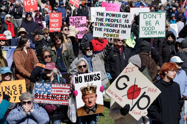 Demonstrators take part in the "No Kings" national day of protest outside the Michigan State Capitol building in Lansing, Michigan, on March 28, 2026. Nationwide protests against US President Donald Trump are expected Saturday as millions of people vent fury over what they see as his authoritarian bent and other forms of cruel, law-trampling governance. It is the third time in less than a year that Americans will take to the streets as part of a grassroots movement called "No Kings," the most vocal and visual conduit for opposition to Trump since he began his second term in January 2025. (Photo by JEFF KOWALSKY / AFP)