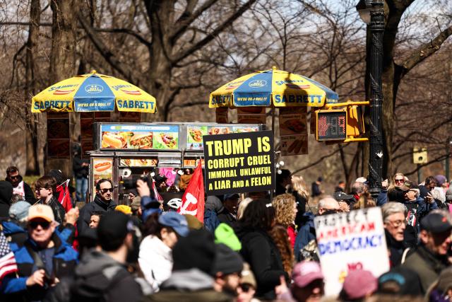 Protesters participate in the "No Kings" national day of protest in New York on March 28, 2026. Nationwide protests against US President Donald Trump are expected Saturday as millions of people vent fury over what they see as his authoritarian bent and other forms of cruel, law-trampling governance. It is the third time in less than a year that Americans will take to the streets as part of a grassroots movement called "No Kings," the most vocal and visual conduit for opposition to Trump since he began his second term in January 2025. (Photo by CHARLY TRIBALLEAU / AFP)
