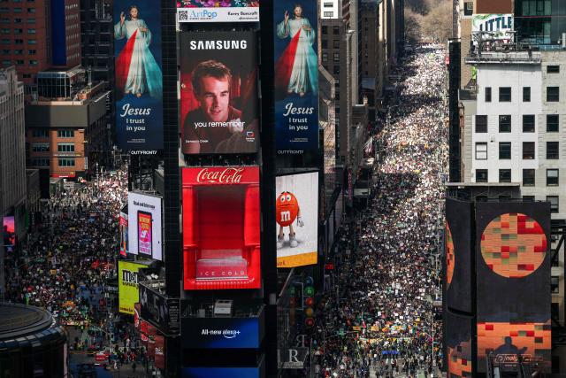 Protesters descend on Times Square during the "No Kings" national day of protest in New York on March 28, 2026. Nationwide protests against US President Donald Trump are expected Saturday as millions of people vent fury over what they see as his authoritarian bent and other forms of cruel, law-trampling governance. It is the third time in less than a year that Americans will take to the streets as part of a grassroots movement called "No Kings," the most vocal and visual conduit for opposition to Trump since he began his second term in January 2025. (Photo by CHARLY TRIBALLEAU / AFP)