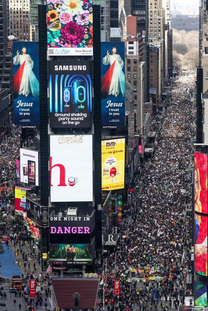 Protesters descend on Times Square during the "No Kings" national day of protest in New York on March 28, 2026. Nationwide protests against US President Donald Trump are expected Saturday as millions of people vent fury over what they see as his authoritarian bent and other forms of cruel, law-trampling governance. It is the third time in less than a year that Americans will take to the streets as part of a grassroots movement called "No Kings," the most vocal and visual conduit for opposition to Trump since he began his second term in January 2025. (Photo by CHARLY TRIBALLEAU / AFP)