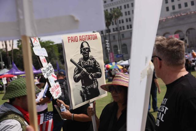 Protestors gather in front of Los Angeles City Hall during the "No Kings" national day of protest in Los Angeles on March 28, 2026. Nationwide protests against US President Donald Trump are expected Saturday as millions of people vent fury over what they see as his authoritarian bent and other forms of cruel, law-trampling governance. It is the third time in less than a year that Americans will take to the streets as part of a grassroots movement called "No Kings," the most vocal and visual conduit for opposition to Trump since he began his second term in January 2025. (Photo by Etienne Laurent / AFP)