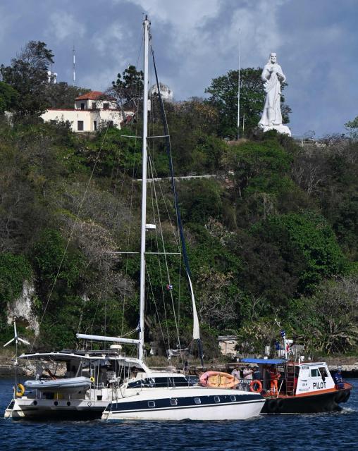 This view shows one of the two sailboats (L) carrying humanitarian aid that had previously gone missing arriving at the port of Havana on March 28, 2026. Two sailboats carrying humanitarian aid to crisis-hit Cuba reached Havana on Saturday after a long journey from Mexico during which they went missing and triggered a search-and-rescue mission, (Photo by Yamil LAGE / AFP)