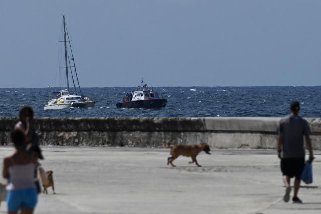 This view shows one of the two sailboats (L) carrying humanitarian aid that had previously gone missing arriving at the port of Havana on March 28, 2026. Two sailboats carrying humanitarian aid to crisis-hit Cuba reached Havana on Saturday after a long journey from Mexico during which they went missing and triggered a search-and-rescue mission, (Photo by Yamil LAGE / AFP)