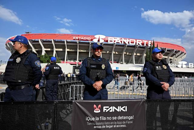 Police officers stand guard before the inauguration of Banorte Stadium (formerly known as Azteca), for a friendly match between Mexico and Portugal, in Mexico City on March 28, 2026. (Photo by Carl de Souza / AFP)