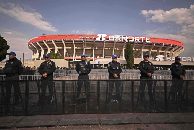 Police officers stand guard before the inauguration of Banorte Stadium (formerly known as Azteca), for a friendly match between Mexico and Portugal, in Mexico City on March 28, 2026. (Photo by Carl de Souza / AFP)