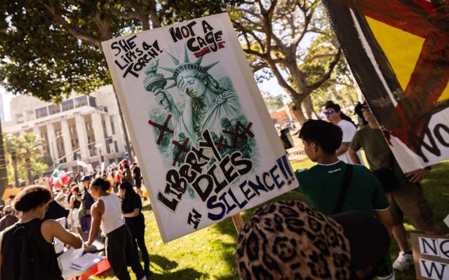 Demonstrators hold a poster depicting a crying Statue of Liberty during the "No Kings" national day of protest in Los Angeles on March 28, 2026. Nationwide protests against US President Donald Trump are expected Saturday as millions of people vent fury over what they see as his authoritarian bent and other forms of cruel, law-trampling governance. It is the third time in less than a year that Americans will take to the streets as part of a grassroots movement called "No Kings," the most vocal and visual conduit for opposition to Trump since he began his second term in January 2025. (Photo by ETIENNE LAURENT / AFP)