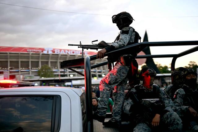 National guard officers patrol before the inauguration of Banorte Stadium (formerly known as Azteca), for a friendly match between Mexico and Portugal, in Mexico City on March 28, 2026. (Photo by YURI CORTEZ / AFP)