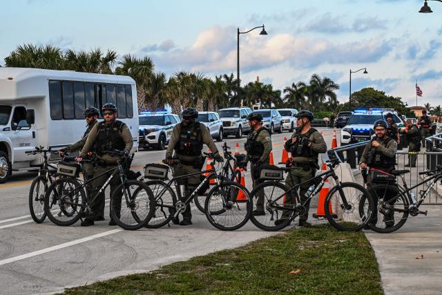 Police officers guard the access points in the vicinity of US President Donald Trump's Mar-a-Lago residence during the "No Kings" national day of protest, in Palm Beach, Florida, on May 28, 2026. Nationwide protests against US President Donald Trump are expected Saturday as millions of people vent fury over what they see as his authoritarian bent and other forms of cruel, law-trampling governance. It is the third time in less than a year that Americans will take to the streets as part of a grassroots movement called "No Kings," the most vocal and visual conduit for opposition to Trump since he began his second term in January 2025. (Photo by Giorgio VIERA / AFP)