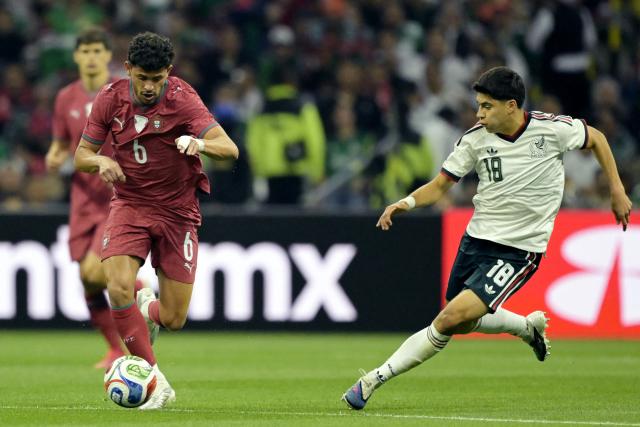 Portugal's midfielder #06 Matheus Nunes and Mexico's midfielder #18 Obed Vargas fight for the ball during a friendly football match between Mexico and Portugal at the Banorte (formerly known as Azteca) Stadium in Mexico City on March 28, 2026. (Photo by Alfredo ESTRELLA / AFP)