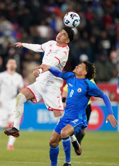 Tunisia's forward #07 Khalil Ayari heads the ball as Haiti's defender #08 Martin Experience attempts to interfere during a friendly football match between Haiti and Tunisia at BMO Field in Toronto, Canada, on March 28, 2026. (Photo by Geoff Robins / AFP)