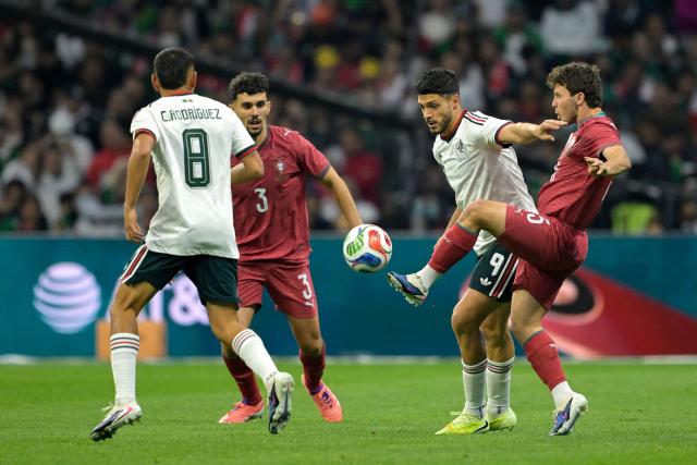 Mexico's midfielder #08 Carlos Rodriguez, Portugal's defender #03 Tomas Araujo, Mexico's forward #09 Raul Alonso Jimenez, AND Portugal's midfielder #15 Joao Neves fight for the ball during a friendly football match between Mexico and Portugal at the Banorte (formerly known as Azteca) Stadium in Mexico City on March 28, 2026. (Photo by Alfredo ESTRELLA / AFP)