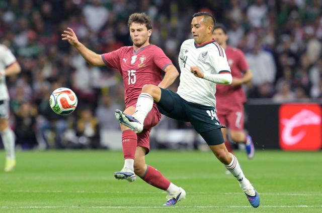 Portugal's midfielder #15 Joao Neves AND Mexico's midfielder #14 Erick Sanchez fight for the ball during a friendly football match between Mexico and Portugal at the Banorte (formerly known as Azteca) Stadium in Mexico City on March 28, 2026. (Photo by Alfredo ESTRELLA / AFP)