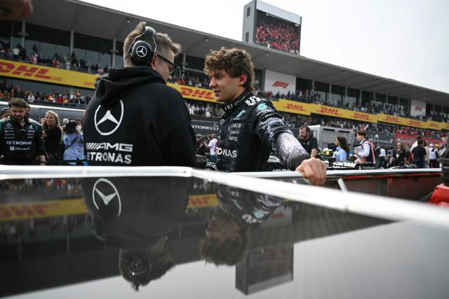 Mercedes' Italian driver Kimi Antonelli (R), who is in pole position, gestures before the start of the Formula One Japanese Grand Prix at the Suzuka circuit in Suzuka, Mie prefecture on March 29, 2026. (Photo by ANDREW CABALLERO-REYNOLDS / AFP)