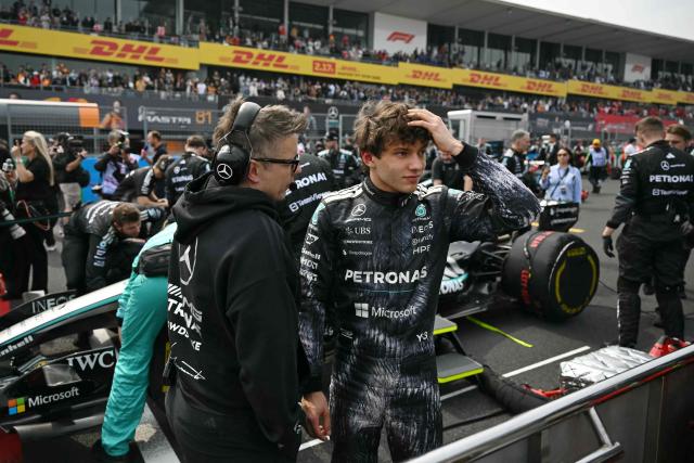 Mercedes' Italian driver Kimi Antonelli (R), who is in pole position, gestures before the start of the Formula One Japanese Grand Prix at the Suzuka circuit in Suzuka, Mie prefecture on March 29, 2026. (Photo by ANDREW CABALLERO-REYNOLDS / AFP)