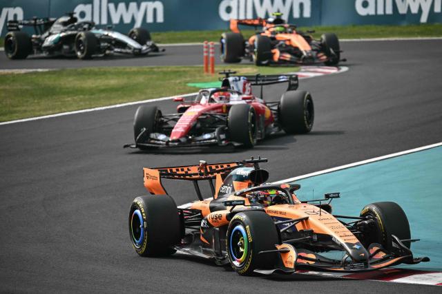 McLaren's Australian driver Oscar Piastri (front R) leads followed by Ferrari's Monegasque driver Charles Leclerc during the Formula One Japanese Grand Prix at the Suzuka circuit in Suzuka, Mie prefecture on March 29, 2026. (Photo by Philip FONG / AFP)