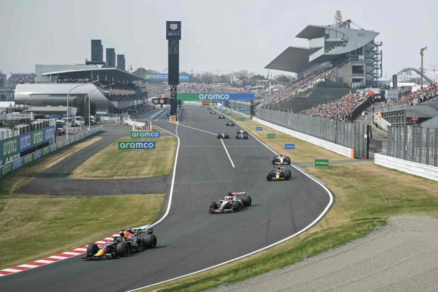 Red Bull Racing's Dutch driver Max Verstappen (L) drives during the Formula One Japanese Grand Prix at the Suzuka circuit in Suzuka, Mie prefecture on March 29, 2026. (Photo by ANDREW CABALLERO-REYNOLDS / AFP)