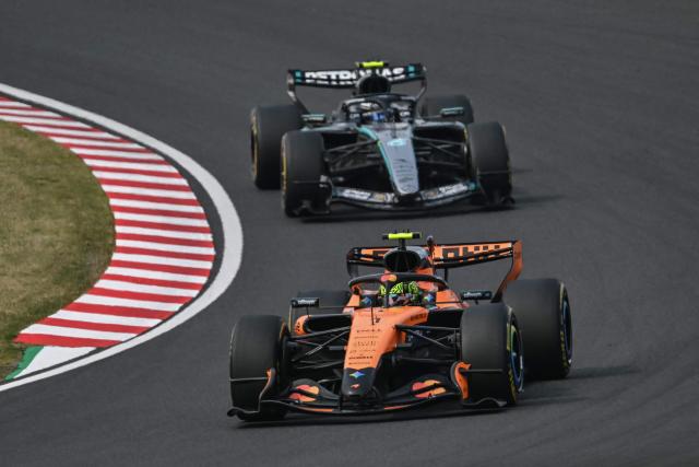 McLaren's Australian driver Oscar Piastri leads Ferrari's Monegasque driver Charles Leclerc during the Formula One Japanese Grand Prix at the Suzuka circuit in Suzuka, Mie prefecture on March 29, 2026. (Photo by ANDREW CABALLERO-REYNOLDS / AFP)