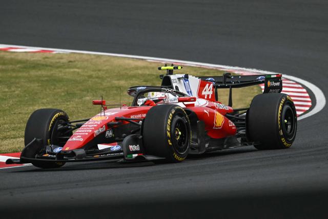 Ferrari's British driver Lewis Hamilton drives during the Formula One Japanese Grand Prix at the Suzuka circuit in Suzuka, Mie prefecture on March 29, 2026. (Photo by ANDREW CABALLERO-REYNOLDS / AFP)