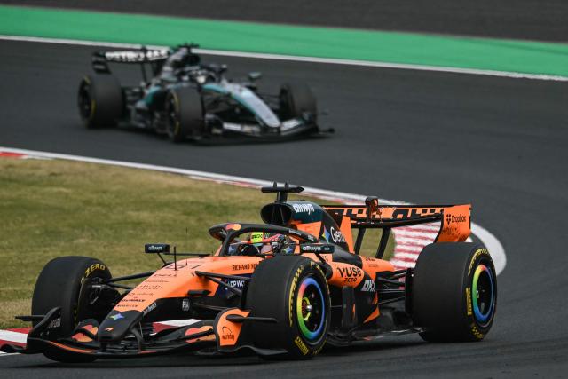 McLaren's Australian driver Oscar Piastri leads followed by Mercedes' British driver George Russell during the Formula One Japanese Grand Prix at the Suzuka circuit in Suzuka, Mie prefecture on March 29, 2026. (Photo by ANDREW CABALLERO-REYNOLDS / AFP)