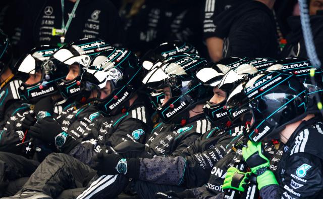 Mercedes' Italian driver Kimi Antonelli's mechanics sit in the pit during the Formula One Japanese Grand Prix at the Suzuka circuit in Suzuka, Mie prefecture on March 29, 2026. (Photo by FRANCK ROBICHON / POOL / AFP)