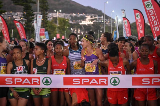 South African Olympic champion Caster Semenya (C) gathers with other runners ahead of the Cape Town SPAR Women’s 10km Challenge in Cape Town on March 29, 2026. (Photo by RODGER BOSCH / AFP)