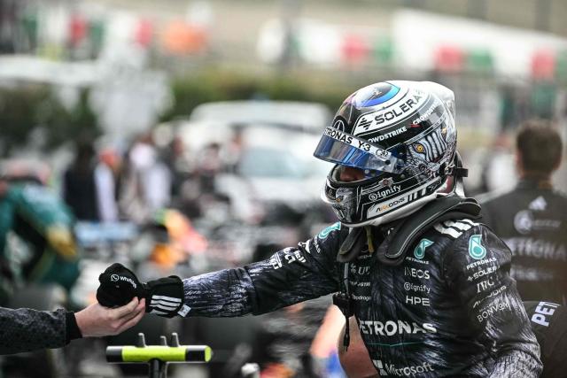 Mercedes' Italian driver Kimi Antonelli celebrates with his team at the parc ferme after winning the Formula One Japanese Grand Prix at the Suzuka circuit in Suzuka, Mie prefecture on March 29, 2026. (Photo by Philip FONG / AFP)