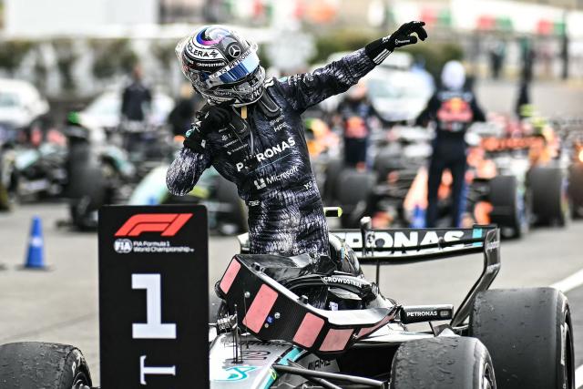 Mercedes' Italian driver Kimi Antonelli celebrates at the parc ferme after winning the Formula One Japanese Grand Prix at the Suzuka circuit in Suzuka, Mie prefecture on March 29, 2026. (Photo by Philip FONG / AFP)