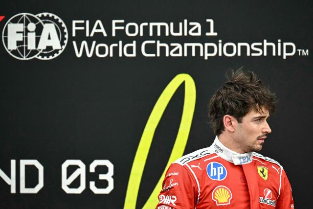 Ferrari's Monegasque driver Charles Leclerc looks on in the parc ferme after finishing third in the Formula One Japanese Grand Prix at the Suzuka circuit in Suzuka, Mie prefecture on March 29, 2026. (Photo by Philip FONG / AFP)