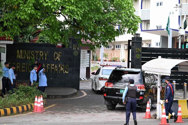 Police officers salute as a motorcade of Pakistan's Foreign Minister Ishaq Dar arrives at the Foreign Ministry office in Islamabad on March 29, 2026. Top diplomats from Riyadh, Cairo and Ankara are due in the Pakistani capital on March 29 and March 30 for "in-depth discussions on a range of issues, including efforts to de-escalate tensions in the region", the Pakistan foreign ministry said. (Photo by Aamir QURESHI / AFP)