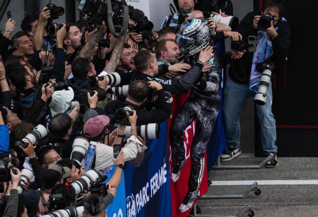Mercedes' Italian driver Kimi Antonelli celebrates at the parc ferme after winning the Formula One Japanese Grand Prix at the Suzuka circuit in Suzuka, Mie prefecture on March 29, 2026. (Photo by ANDREW CABALLERO-REYNOLDS / AFP)