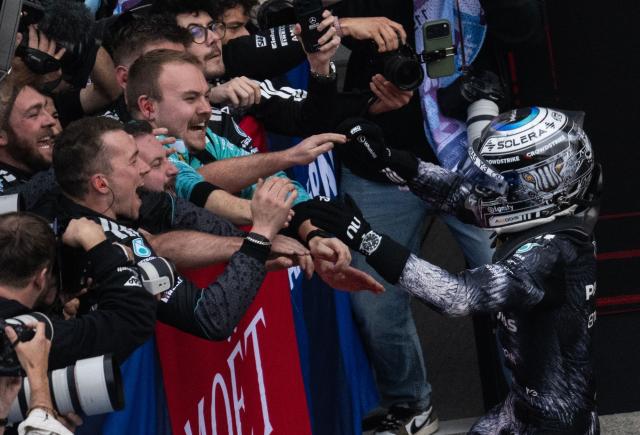 Mercedes' Italian driver Kimi Antonelli celebrates at the parc ferme after winning the Formula One Japanese Grand Prix at the Suzuka circuit in Suzuka, Mie prefecture on March 29, 2026. (Photo by ANDREW CABALLERO-REYNOLDS / AFP)