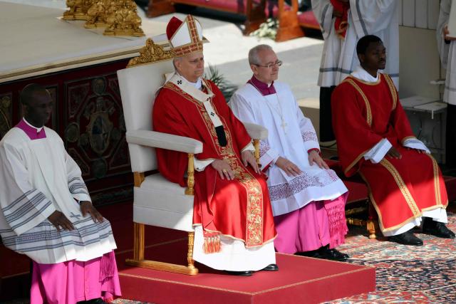 Pope Leo XIV leads a mass for Palm Sunday by  at St Peter's square in the Vatican on March 29, 2026. (Photo by Marco BERTORELLO / AFP)