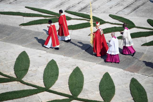 Pope Leo XIV arrives to lead a mass for Palm Sunday by  at St Peter's square in the Vatican on March 29, 2026. (Photo by Marco BERTORELLO / AFP)