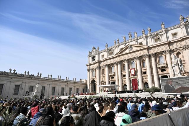 Worshippers attend a mass for Palm Sunday by Pope Leo XIV at St Peter's square in the Vatican on March 29, 2026. (Photo by Tiziana FABI / AFP)
