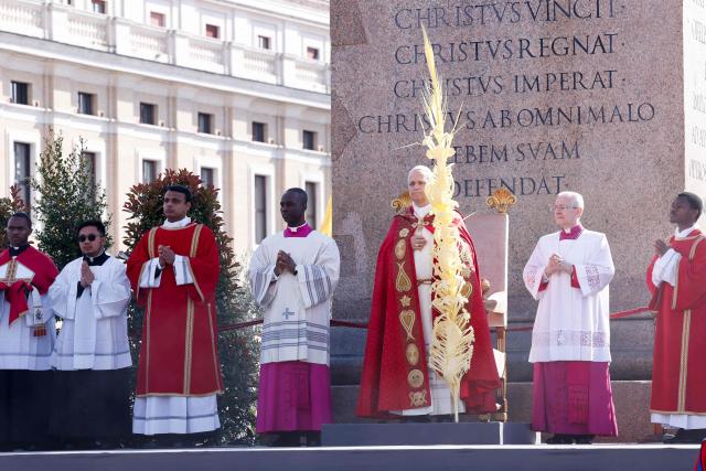 Pope Leo XIV leads a mass for Palm Sunday at St Peter's square in the Vatican on March 29, 2026. (Photo by REMO CASILLI / POOL / AFP)